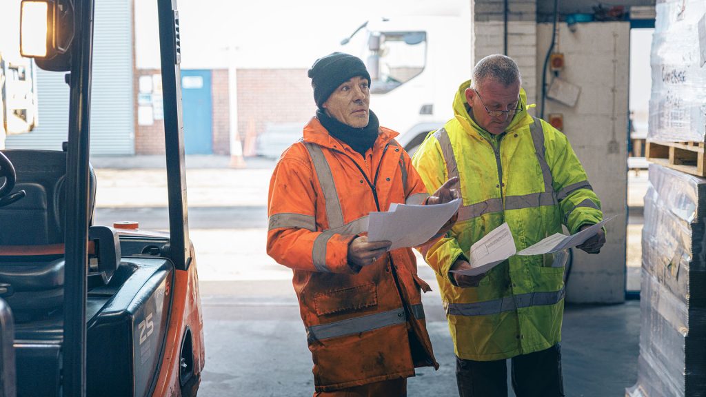 Warehousing staff checking stock