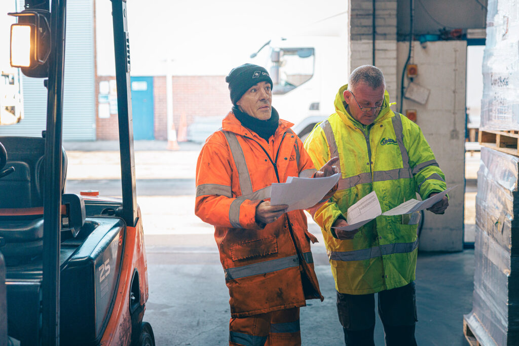 Warehouse staff checking stock inventory. Utilising experts for your third-party warehousing. 