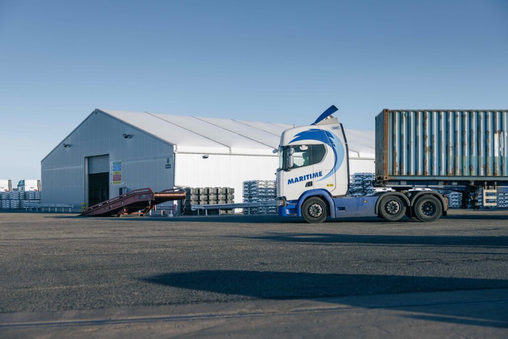 Image shows lorry outside a warehouse