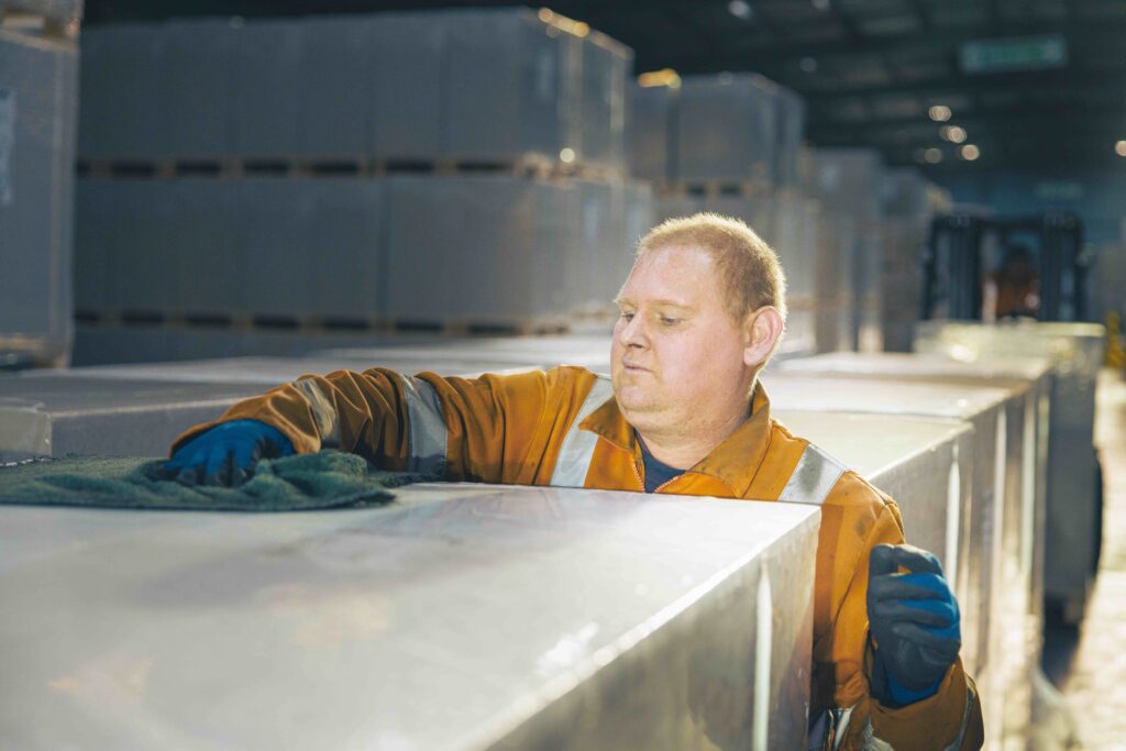 Warehouse staff keeping a storage facility clean and tidy