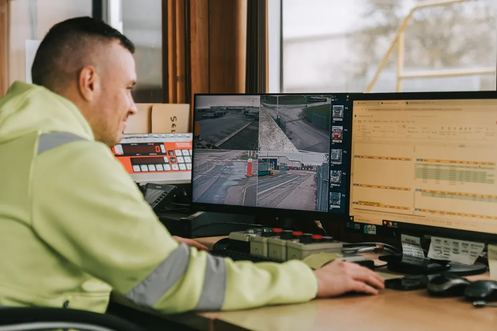 GWS staff member monitoring CCTV screens in the site security office